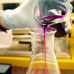 image of pouring liquid from a beaker